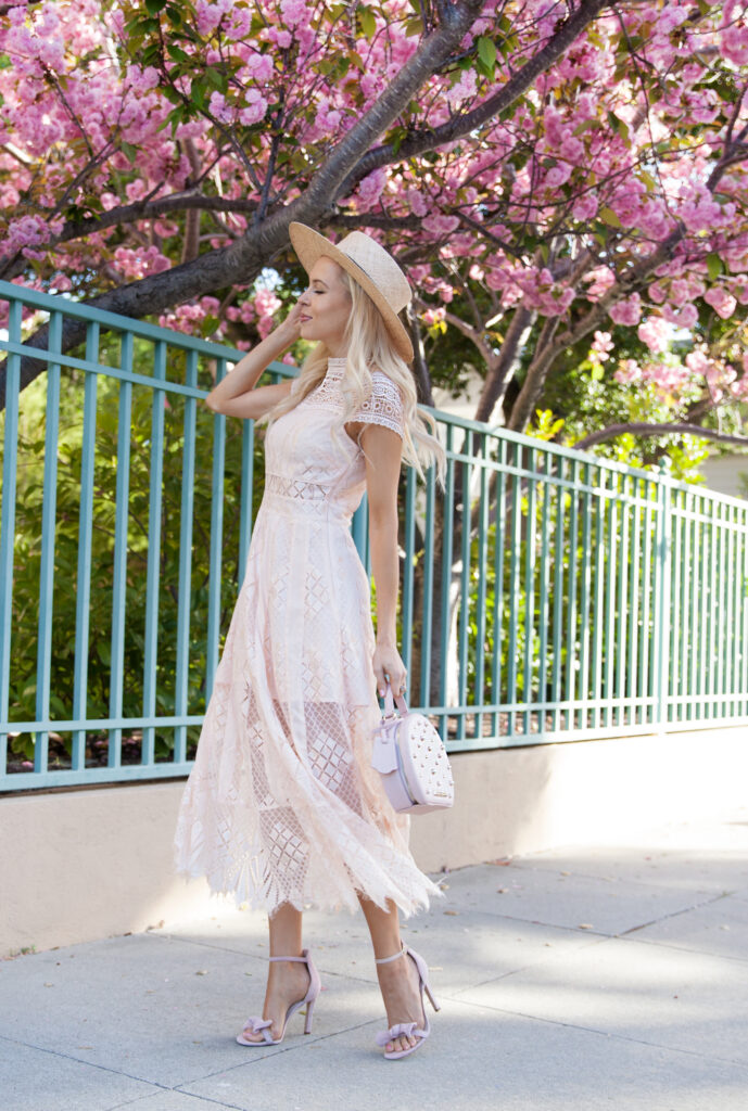 Foxiedox lace dress, star mela boater straw hat, poppy & peonies circle bag, cherry blossoms