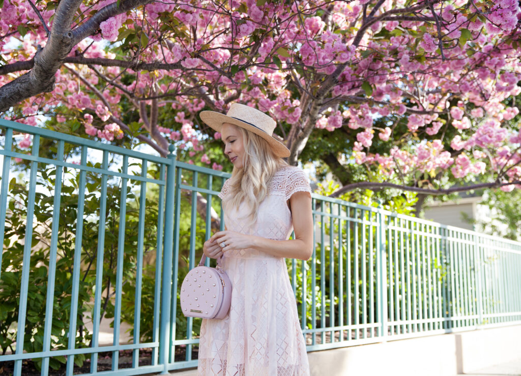 Foxiedox lace dress, star mela boater straw hat, poppy & peonies circle bag, cherry blossoms