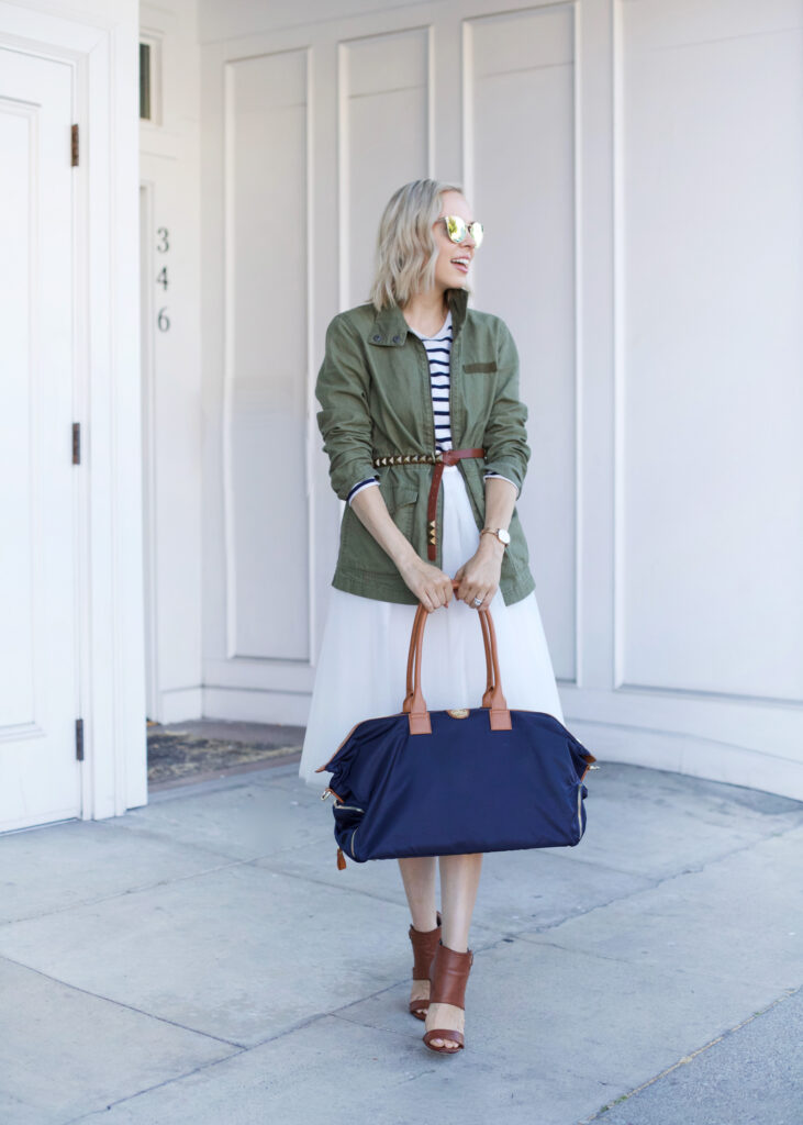 Jemma Bag featured by top US fashion blog, Lombard and Fifth: image of a blonde woman with a Birdie Jemma bag, a Madewell military jacket, and a J Crew striped top