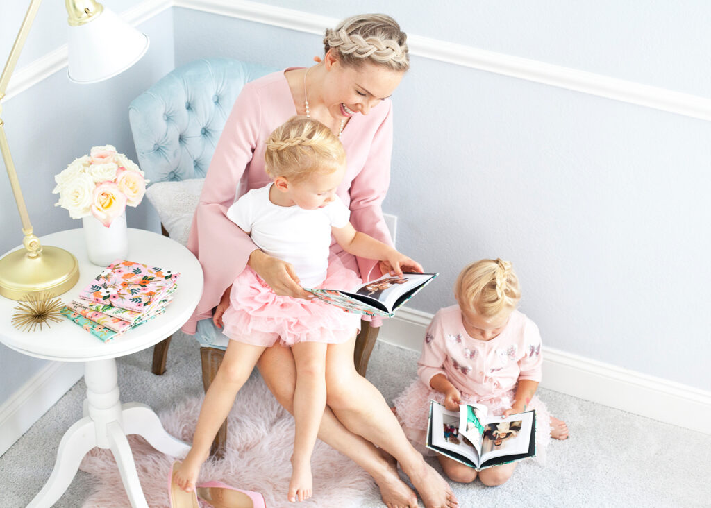 Rifle Paper Co for Chatbooks' floral prints featured by top US life and style blog, Lombard & Fifth: image of a mom and her 2 girls looking at a Chatbooks photo album
