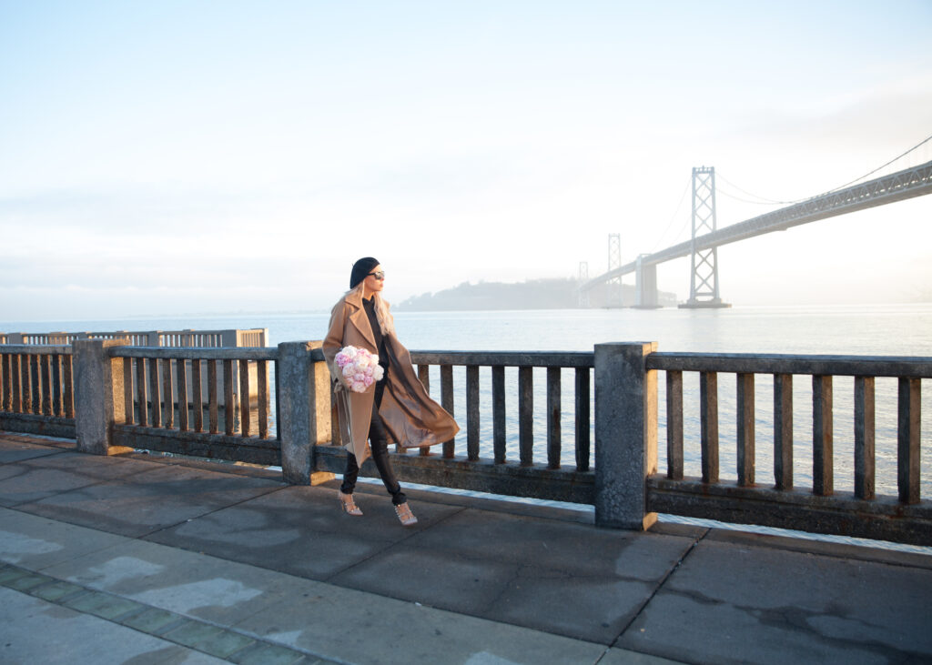 J.Ing Limited coat featured by top US fashion blog, Lombard and Fifth: image of a woman by the Golden Gate bridge in San Francisco wearing a J.Ing Limited coat, J Crew sweater, Diesel leggings.