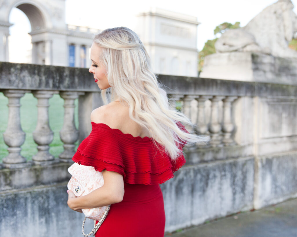 Eliza J body con dress red_Valentine's Day style | Red Eliza J Dress styled for Valentine’s Day by top US fashion blog, Lombard and Fifth: image of a blonde woman wearing an Eliza Dress of the shoulder dress, Simply faux fur jacket, Rue La La glitter bag and Christian Louboutin shoes