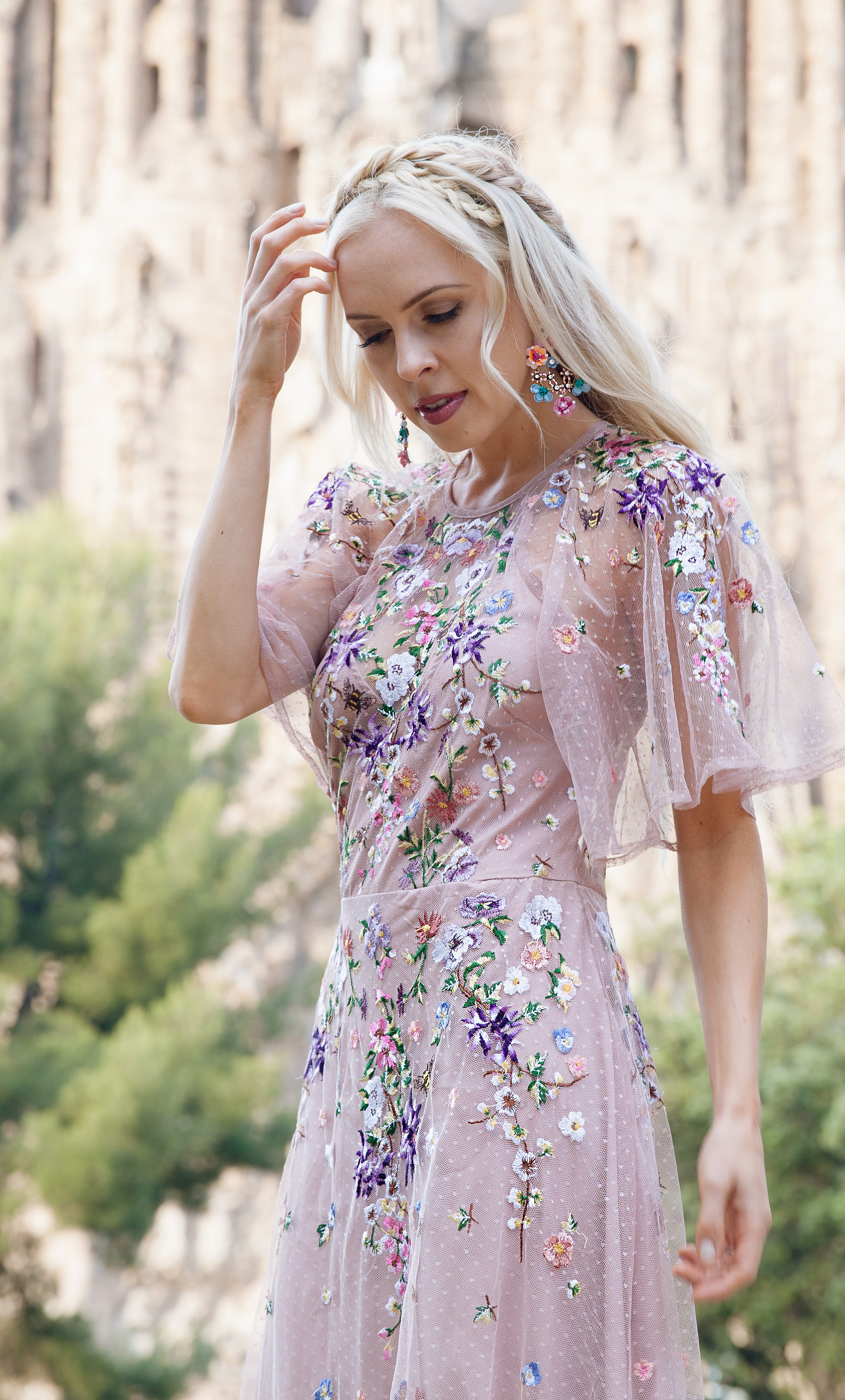 ASOS DESIGN Bridesmaid floral embroidered dobby mesh flutter sleeve maxi dress in barcelona  | ASOS floral embroidered maxi dress featured by top San Francisco fashion blog, Lombard and Fifth: image of a blonde woman wearing a floral maxi dress at the Colosseum in Rome