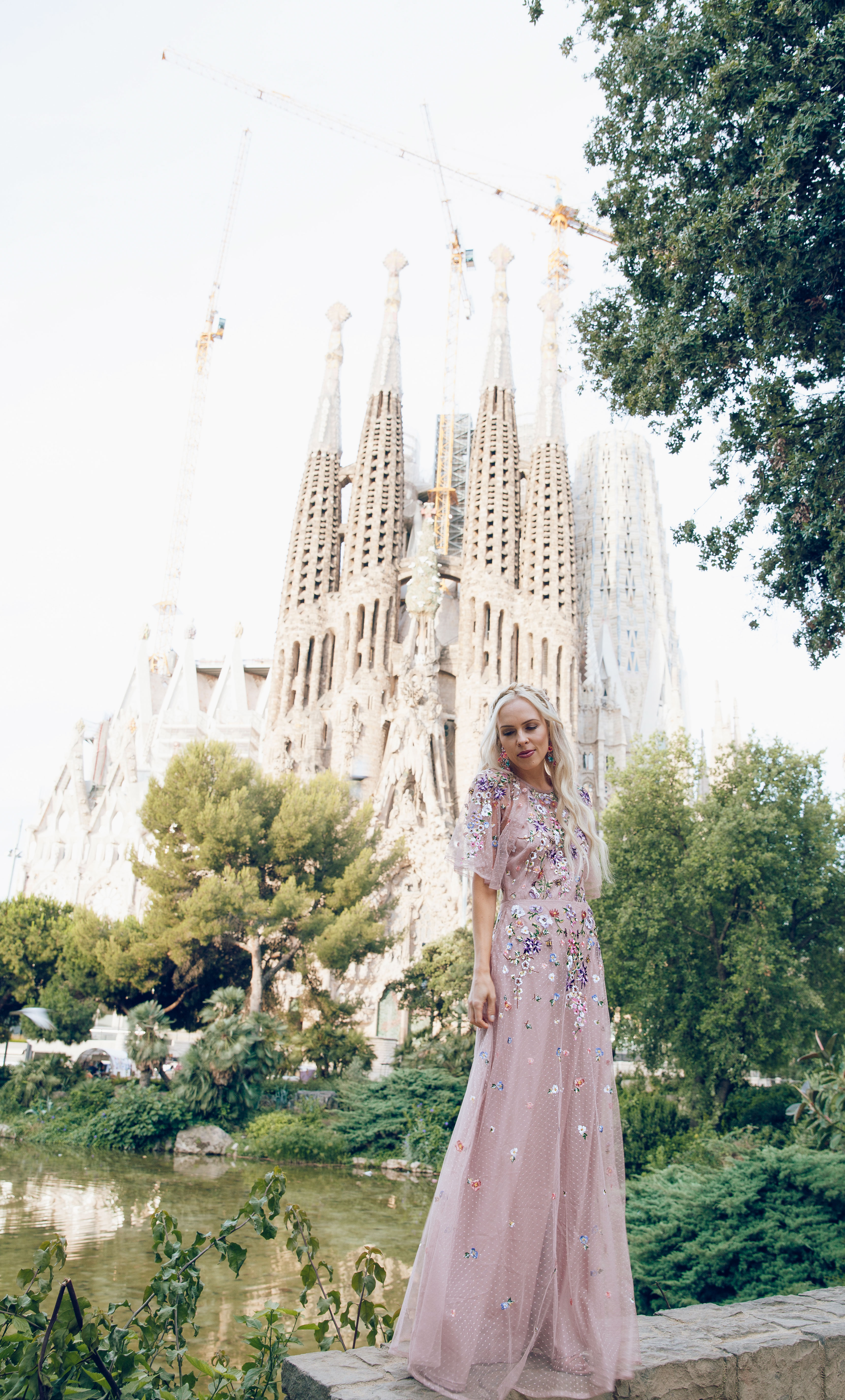 ASOS DESIGN Bridesmaid floral embroidered dobby mesh flutter sleeve maxi dress in barcelona | ASOS floral embroidered maxi dress featured by top San Francisco fashion blog, Lombard and Fifth: image of a blonde woman wearing a floral maxi dress at the Colosseum in Rome