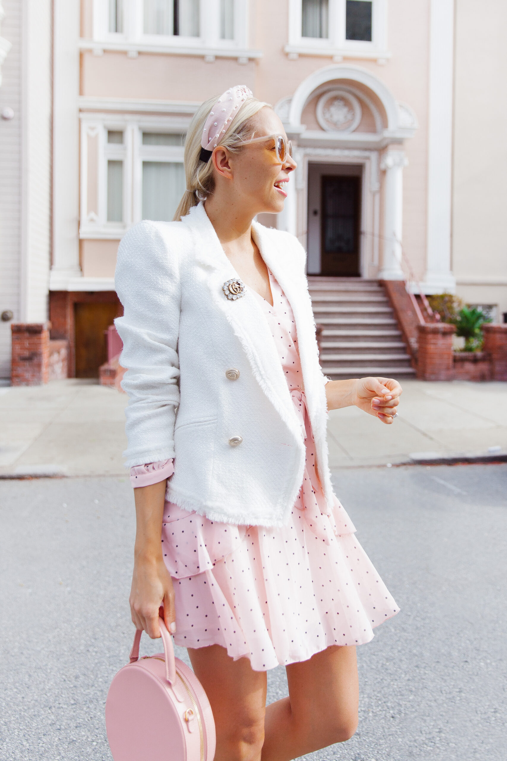Stylish Spring Work Outfits featured by top US fashion blog, Lombard and Fifth: image of a woman wearing a Chicwish pink dress and River Island white blazer