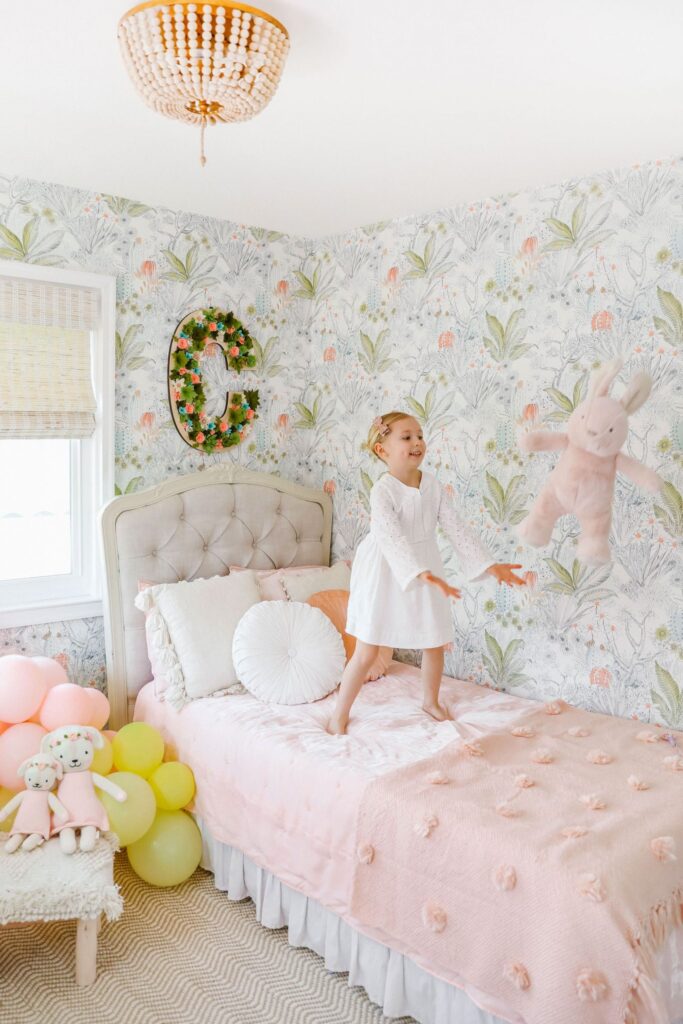 Green and pink boho girls room décor inspiration with Anthropologie wallpaper, Paynes Gray rug, select blinds wooden shades. By top San Francisco fashion blog, Lombard and Fifth.