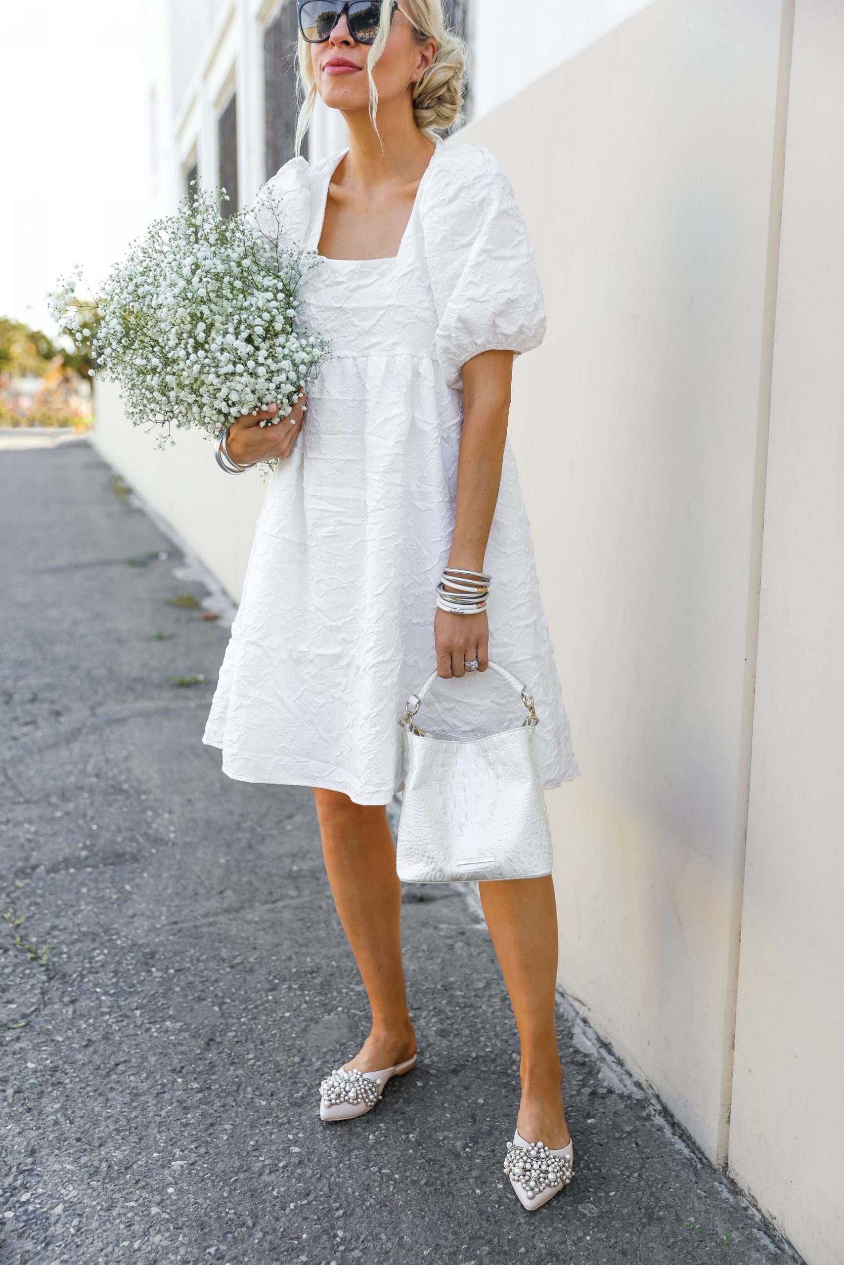 White Vita Grace midi dress with budha girl bracelets, feminine style by fashion blogger Lombard & Fifth styling beautiful accessories.