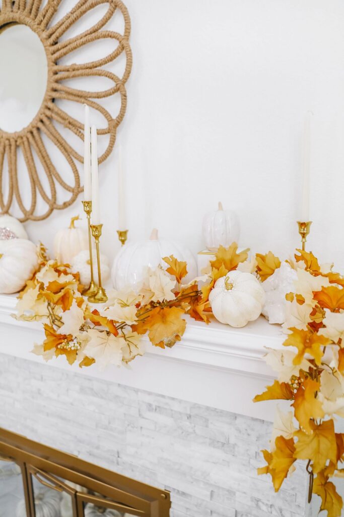 Easy glam neutral fall mantel décor update ideas. Glass pumpkins, voluspa pumpkin spice candles.