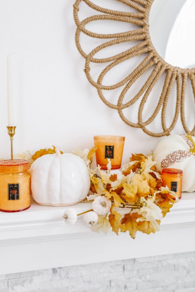 Easy glam neutral fall décor mantle update ideas. Glass pumpkins, voluspa pumpkin spice candles.