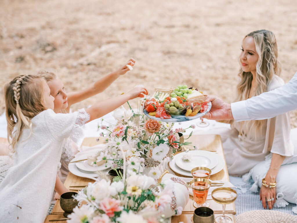 Whimsical boho picnic photoshoot ideas, with family in an outdoor location, featured by San Francisco fashion blogger Lombard & Fifth.