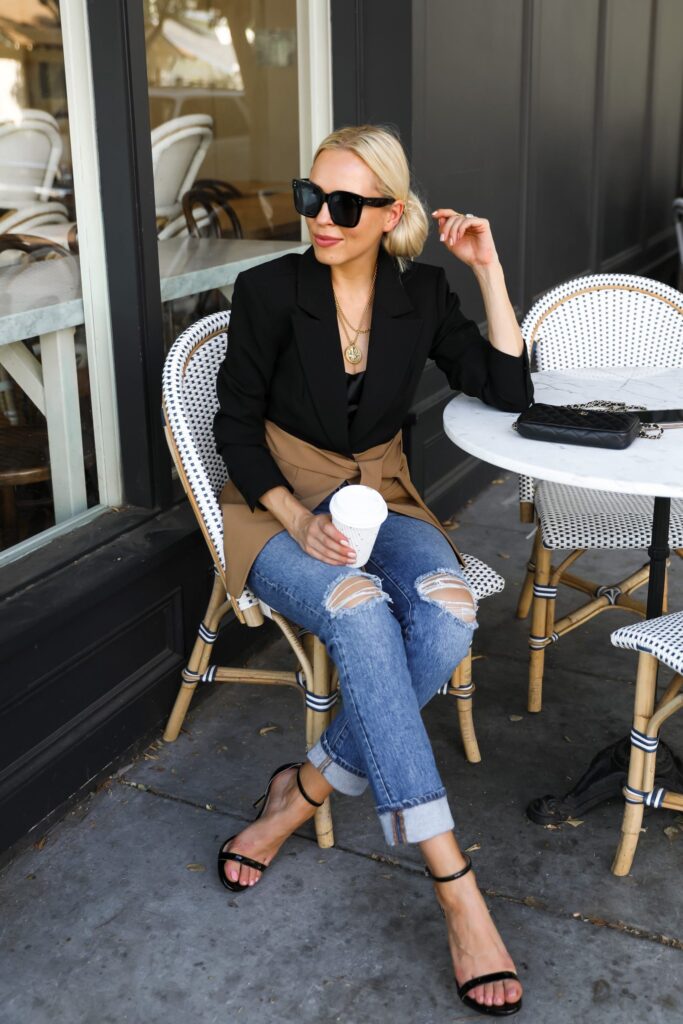 Good American side slit two-tone blazer, with denim casual chic style, by San Francisco fashion blogger Lombard & Fifth. French coffee shop.