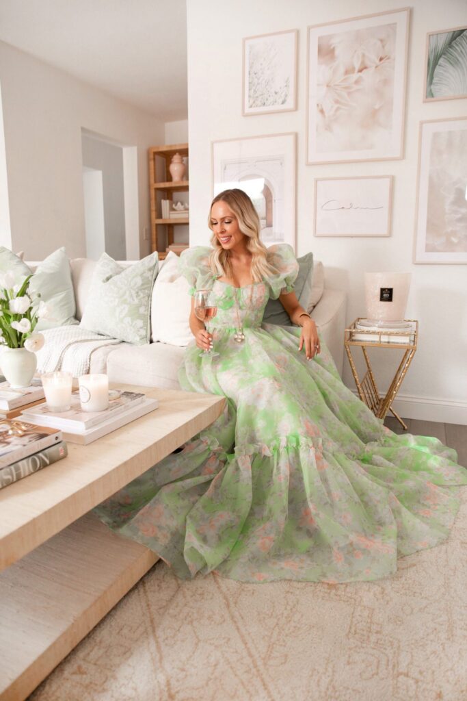 Spring home décor refresh, adding color to your space with throw pillows, candles, coffee table books, framed art. Selkie Ritz dress, by Lombard & Fifth, Veronica Levy.