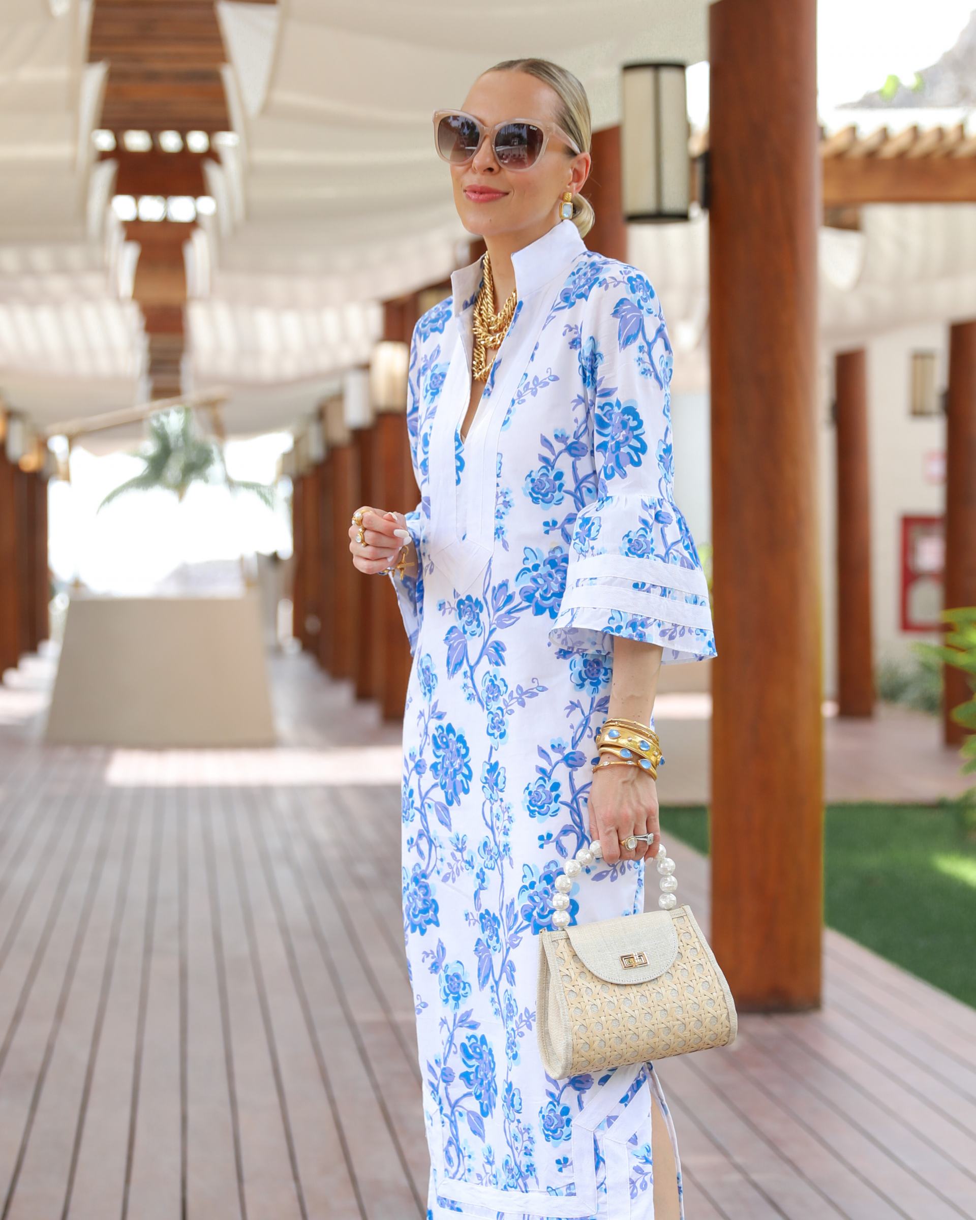 Jennifer Lake x Sail to Sable collaboration launch on 4/25. Blue Kit Kaftan dress styled for resort travel summer inspiration by Veronica Levy, Lombard & Fifth.