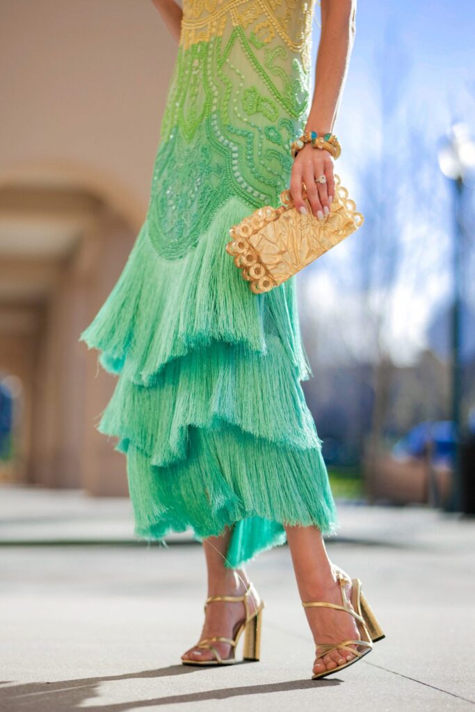Karen Millen fringe teal mini dress sale and more fringe trend style inspiration. By Veronica Levy Lombard & Fifth.