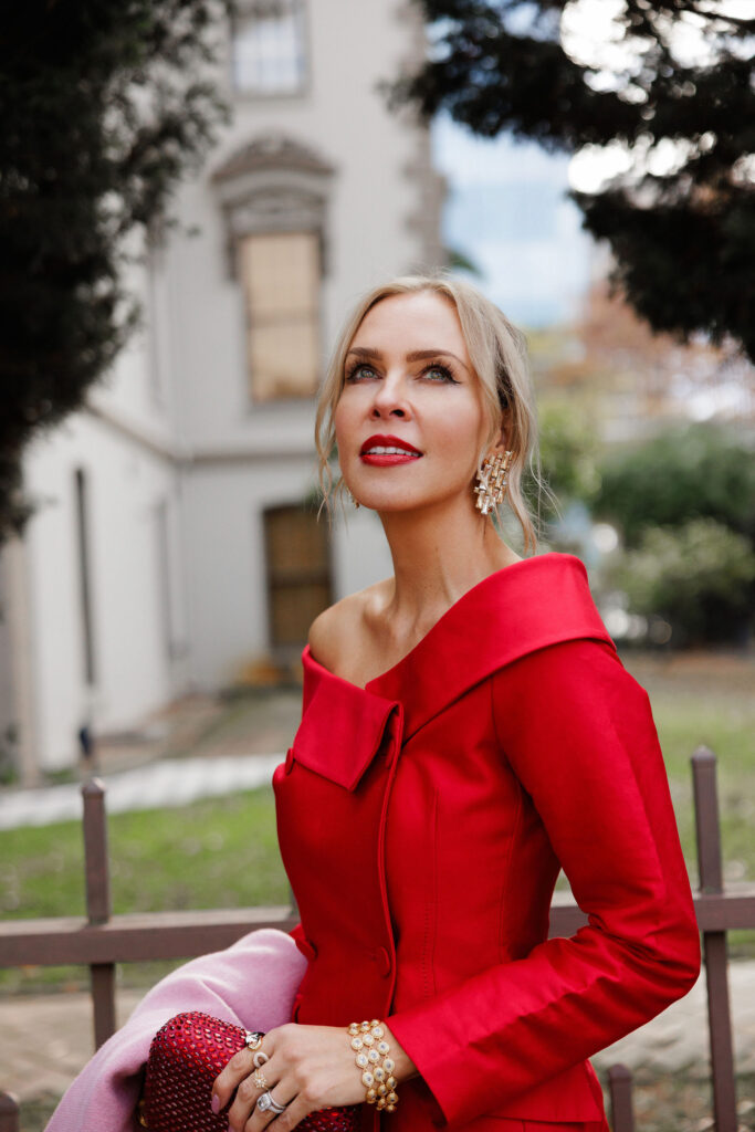 Red holiday dress styled for festive evening occasions