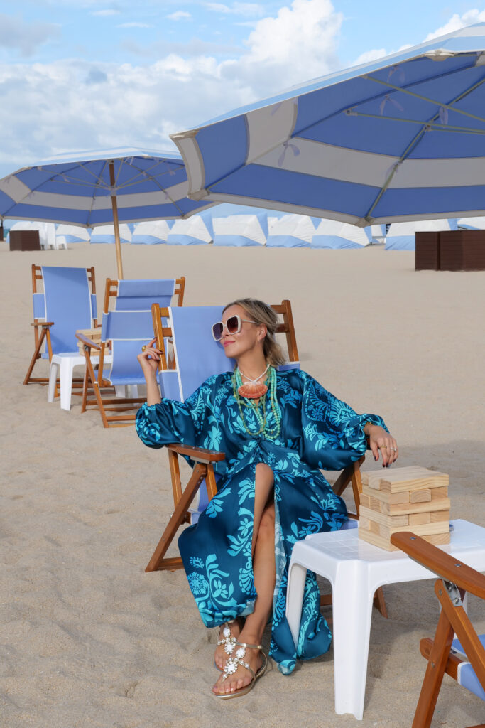 Colorful resort dress styled with shell necklace for Caribbean vacation