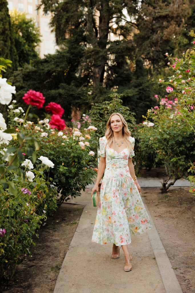 Elegant garden party fashion featuring a feminine floral midi dress