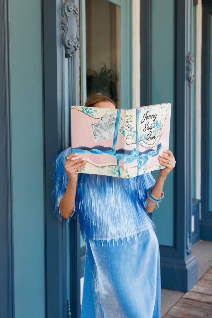Light blue satin maxi dress with fringe cape top and blue embellished sandals styled in a monochromatic blue outfit.